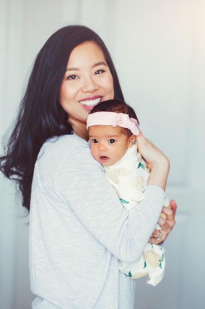 portrait of smiling mother and daughter