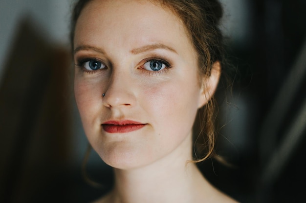 portrait of smiling young woman at cafe