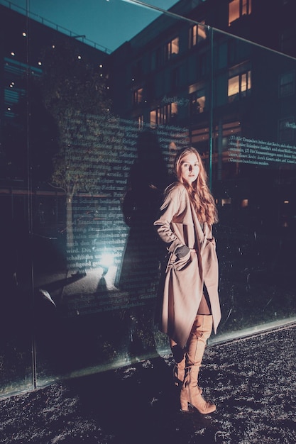 portrait of woman against building