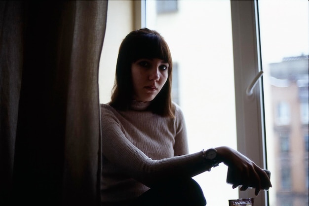 portrait of woman by window