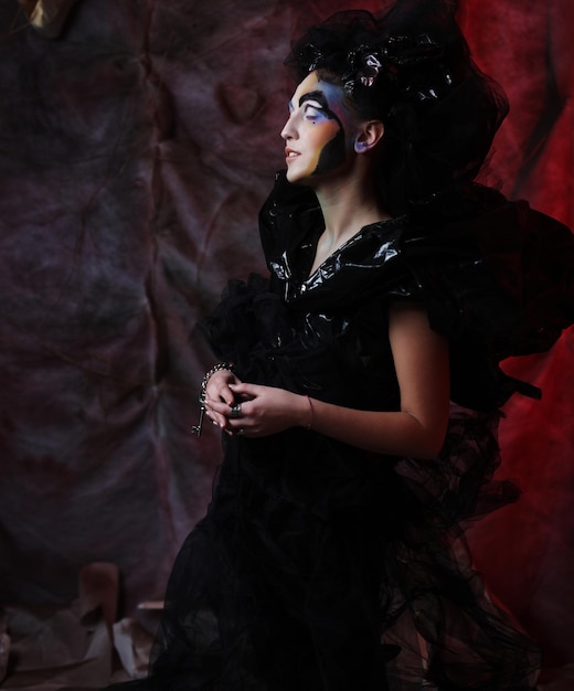 portrait of young stylisn woman with creative visage halloween party