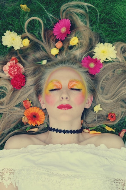 portrait of young woman with flowers