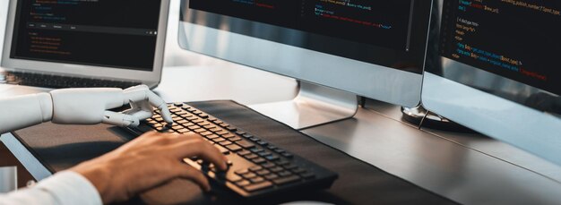 Program coding automation by generative artificial intelligence or AI concept Collaboration between robotic hand and human software developer solving debugging or writing scriptTrailblazing