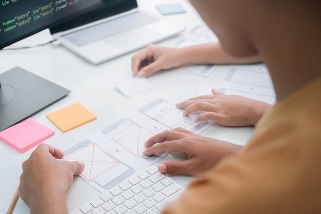 Programmer and UX UI designer working in a software development and coding technologies. APP design and programming development technology.