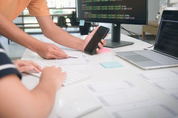 Programmer and UX UI designer working in a software development and coding technologies. APP design and programming development technology.