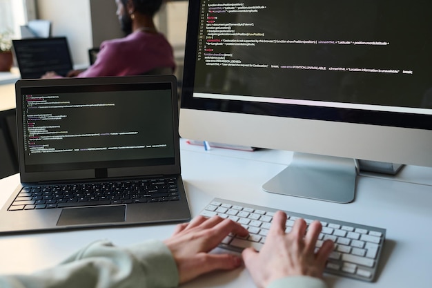 Programmer typing codes for computer program