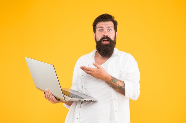 Programmer with laptop Bearded man with notebook Online shopping Man using notebook Surfing internet In search of inspiration Online payment Online purchase Digital world Programming concept
