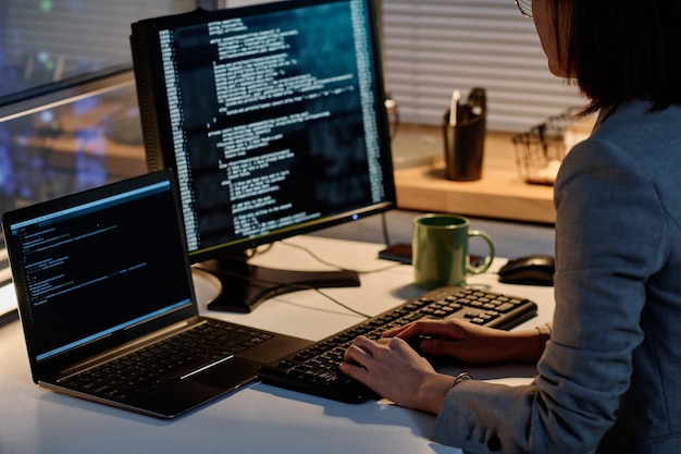Programmer working with security codes on computer