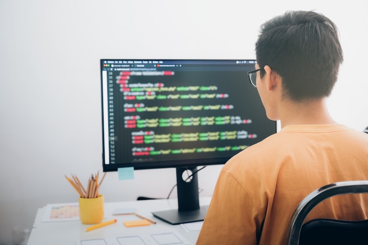 Photo programmers and developer teams are coding and developing software.