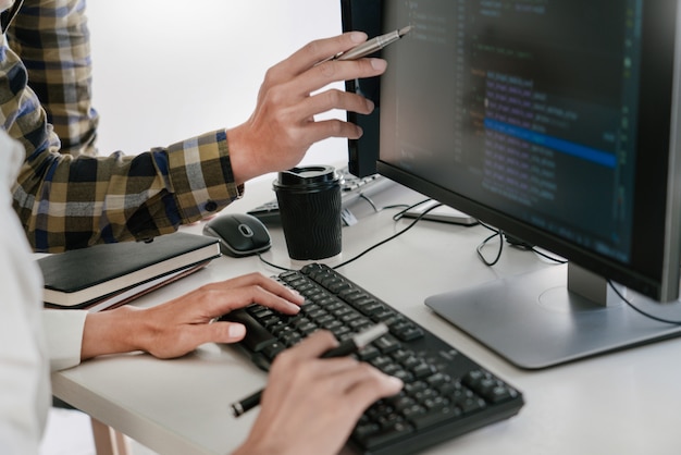 Programmers developing codes on their computers