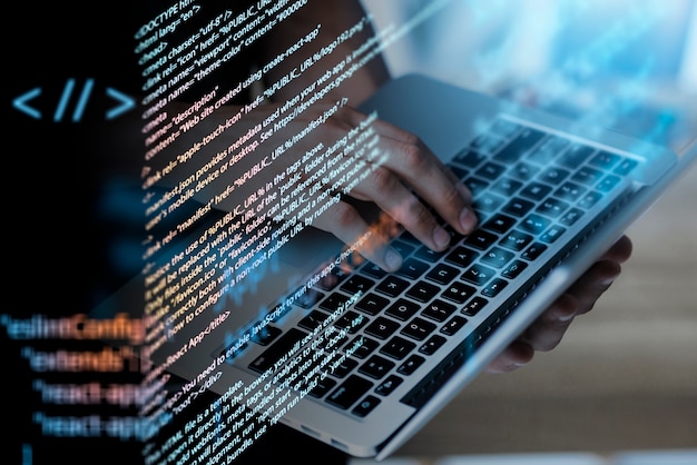 Programming background with person working with codes on computer