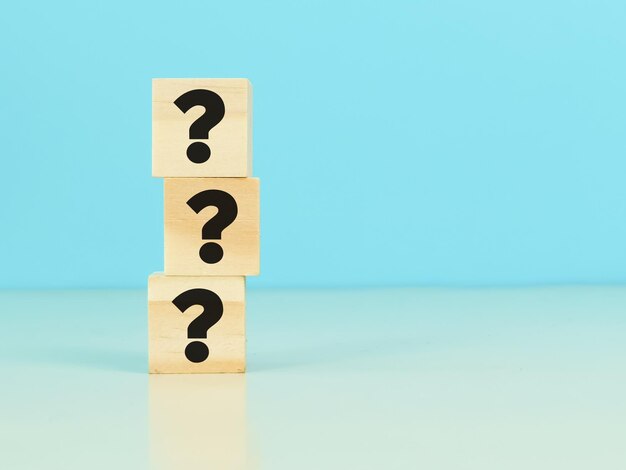 Question mark concept. Wooden cubes with question mark symbol.