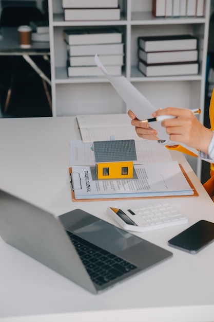 real estate agent Delivering sample homes to customers mortgage loan contracts Make a contract for hire purchase and sale of a house and home insurance contracts home mortgage loan concepts