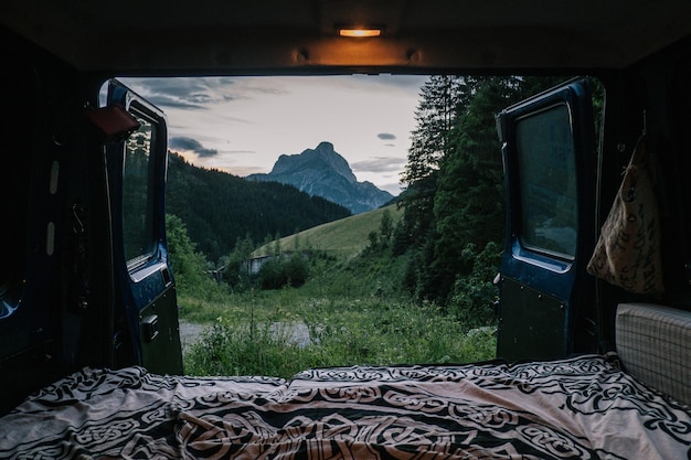 scenic view of mountains against sky seen through window