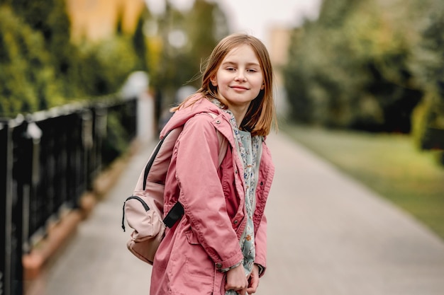 schoolgirl walking at street