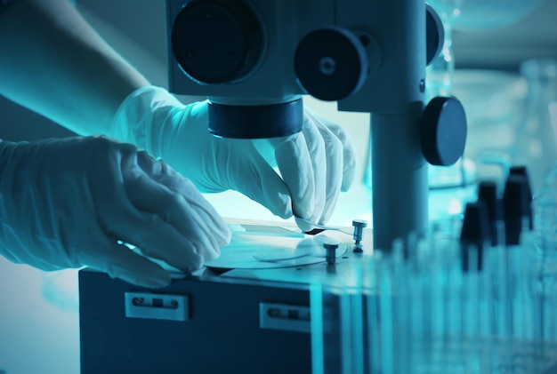 scientist working with microscope closeup