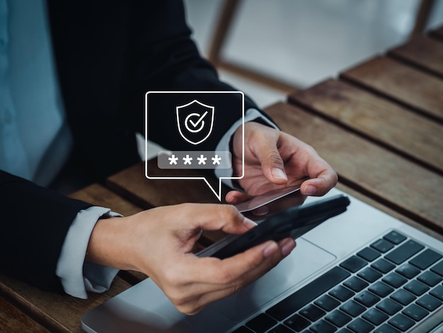 Secure payment concept Safety shield icon with password showing after received verification code on sms on mobile smart phone while using credit card to purchase online shopping payment concepts