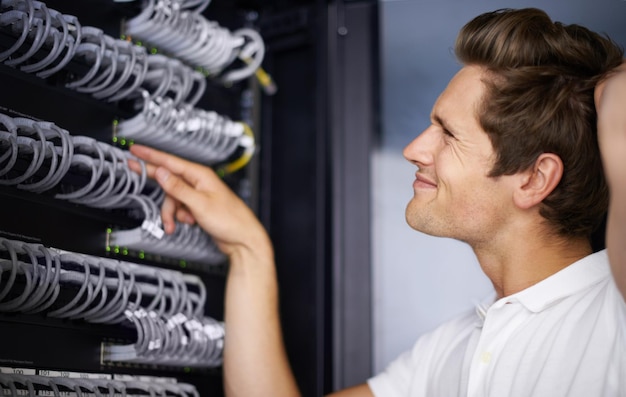 server room confused man and check cables with thinking for connectivity night and hardware cybersecurity system it network and technician for glitch data center and problem solving for error