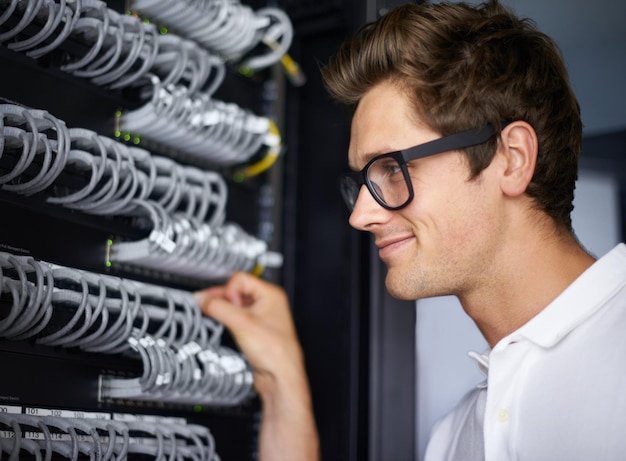 server room information technology and man with cables for connectivity night and check hardware cybersecurity system it network or person for internet data center or storage solution with ideas