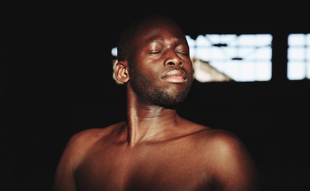 shirtless young man with eyes closed