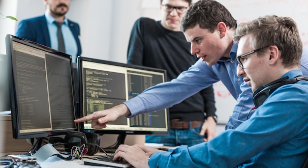 Side view of business colleagues working in office