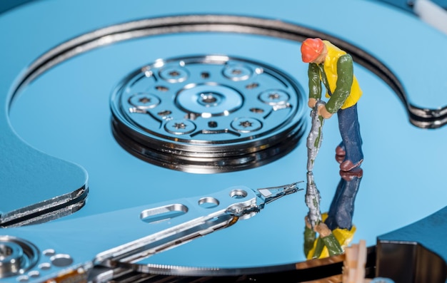 Small mining figurine illustrating concept of artificial intelligence or machine learning using deep data analytics