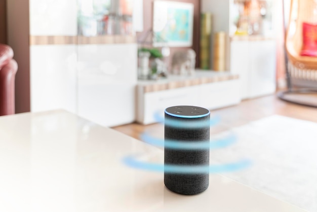 Smart loudspeaker assistant echo stands in a bright living room