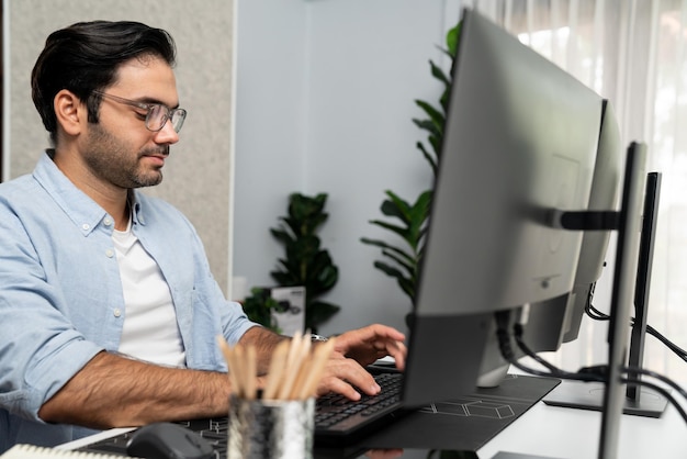 Smart professional businessman searching on pc with business data Surmise