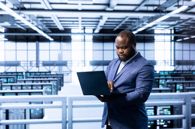 Software developer in data center implementing backup solutions