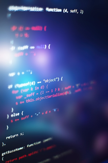 Software developer programming code. Abstract computer script code. Selective focus
