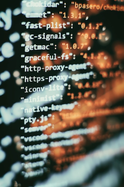 Software developer programming code. Abstract computer script code. Selective focus