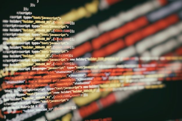 Software developer programming code. Abstract computer script code. Selective focus