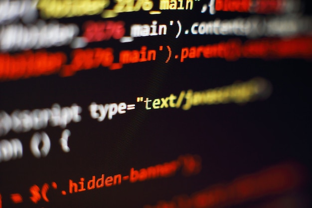 Software developer programming code. Abstract computer script code. Selective focus