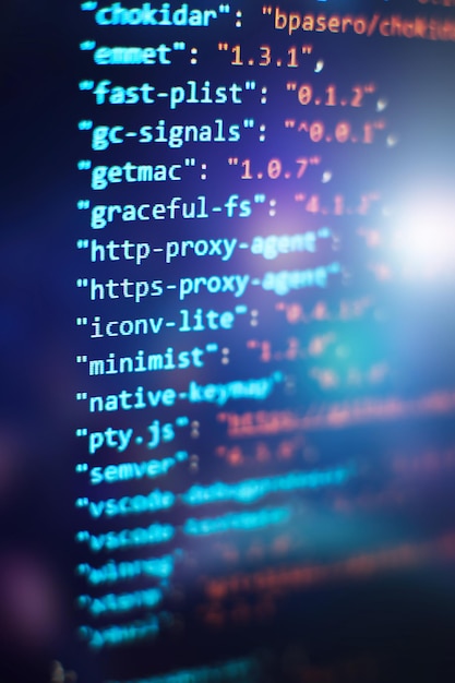 Software developer programming code. Abstract computer script code. Selective focus
