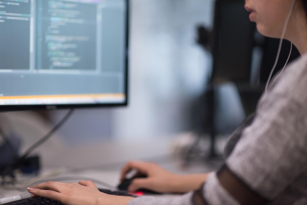 software developer writing programming code on computer