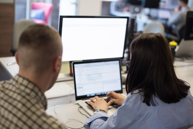 software developer writing programming code on laptop computer