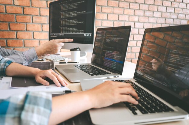 Software developers using laptop