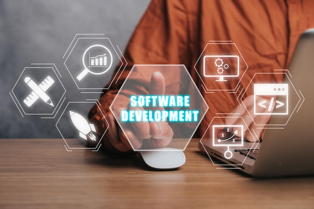software development concept person working on laptop computer with software development icon on virtual screen