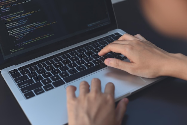 Software development Programmer software developer coding HTML programming Javascript on laptop computer screen
