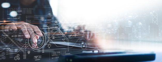 Software engineer working on tablet and laptop computer with big data con virtual screen technology network data exchange and software development data science and system management
