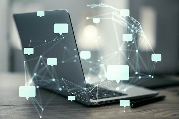 speech bubbles and network connections over a laptop on a wooden desk background