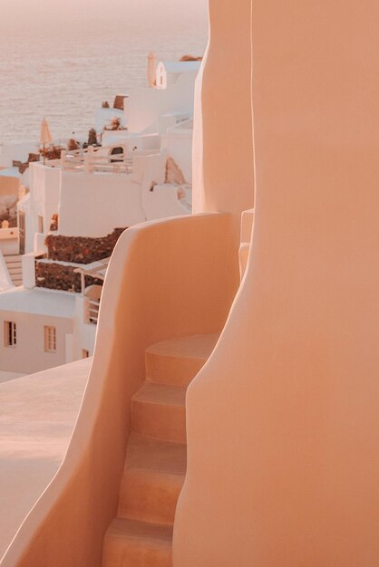 Staircase in sea against buildings