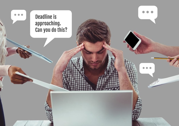 Stressed man in office working for deadline under pressure
