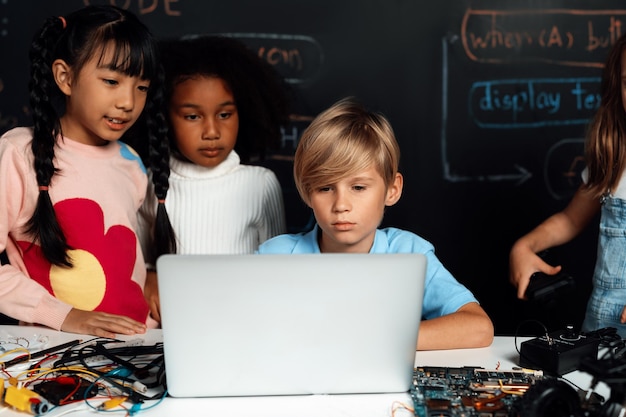 Student learn about coding robotics car in STEM class with attention Erudition