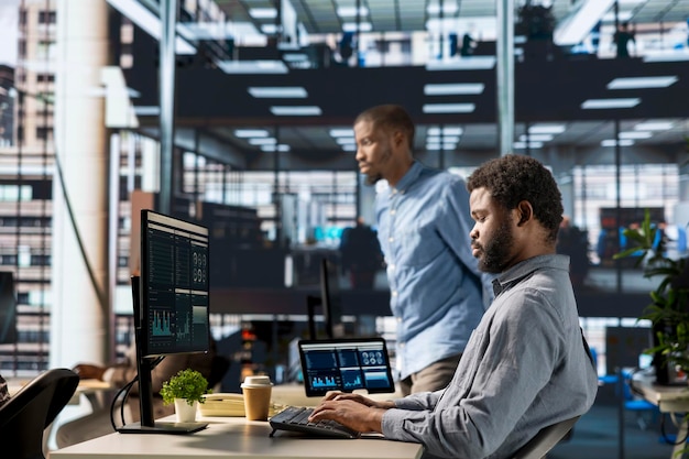 Successful african american employee manages financial planning