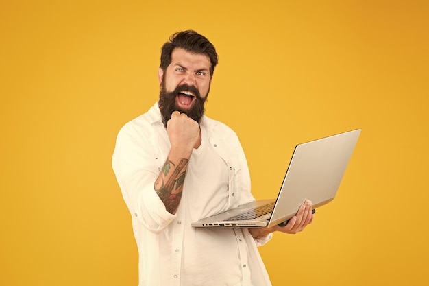 Successful developer Bearded man with notebook Online shopping Man using notebook Digital world Programming concept Programmer with laptop Surfing internet Online payment Online purchase