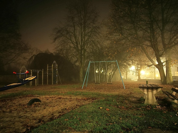 swings at playground against sky