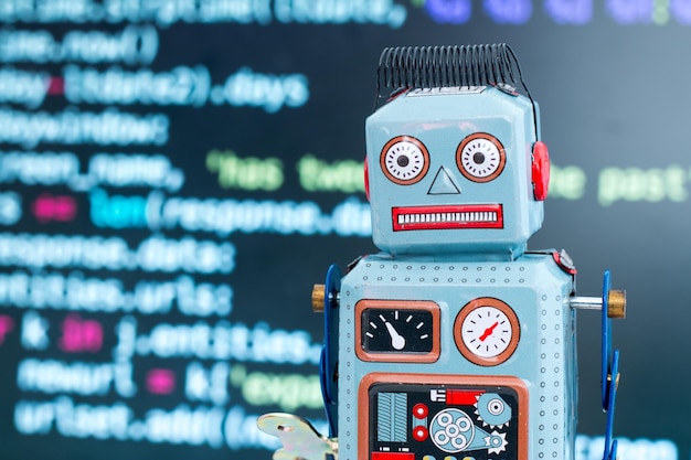 Symbol for a chatbot or social bot and algorithms program code in the background