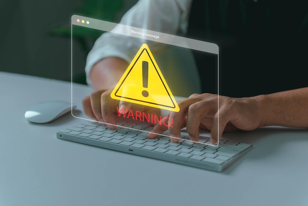 System hacked warning alert Man using laptop with cyber attack network virus spyware scam or Malicious software Cyber security and cybercrime Compromised information internet