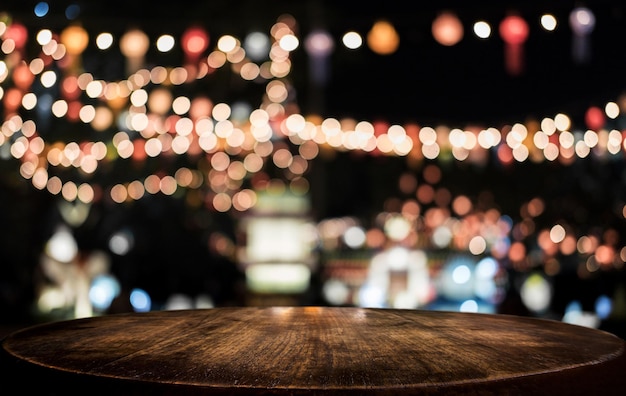 Table against illuminated lighting equipment at night